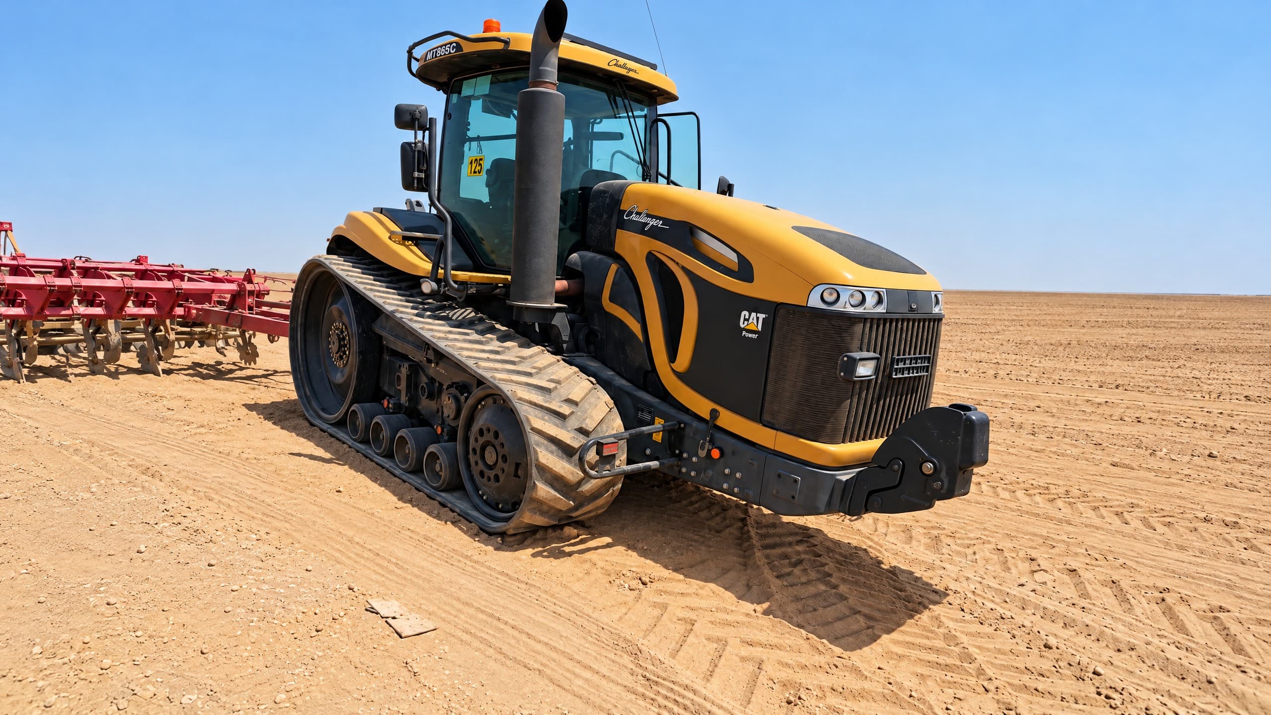 Challenger MT865C tracked tractor on sand.
