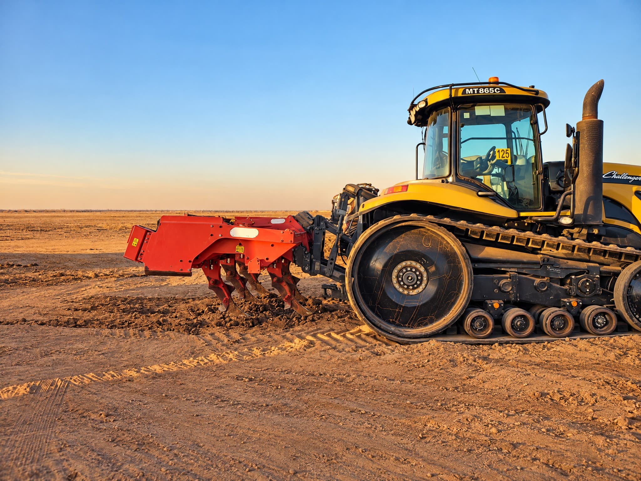 Challenger MT865C fitted with a heavy ripper at dawn.